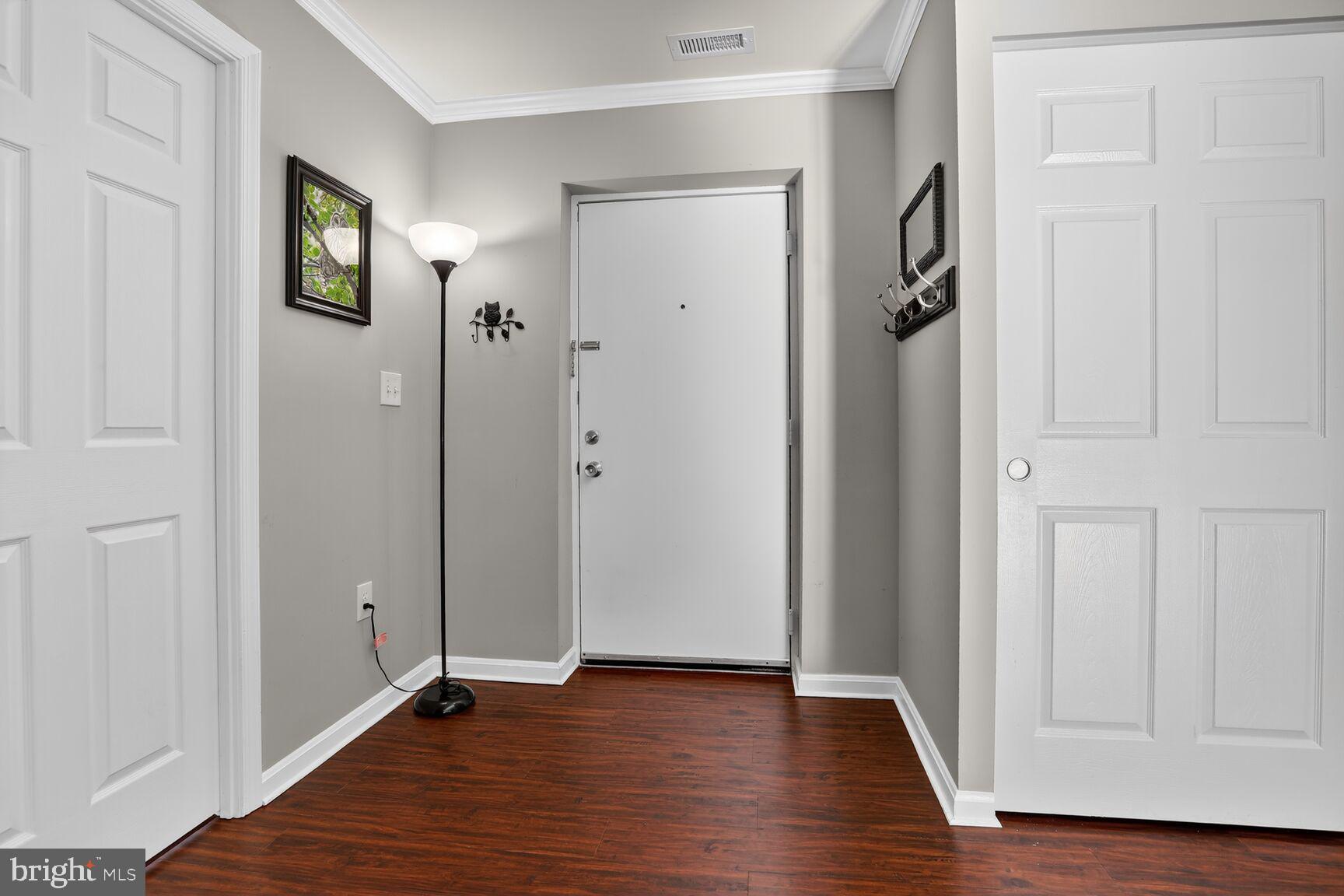 4106 Chardel Road, Unit 2G Baltimore, MD 21236 - Photo 2 of 25 a view of an empty room with wooden floor and closet area