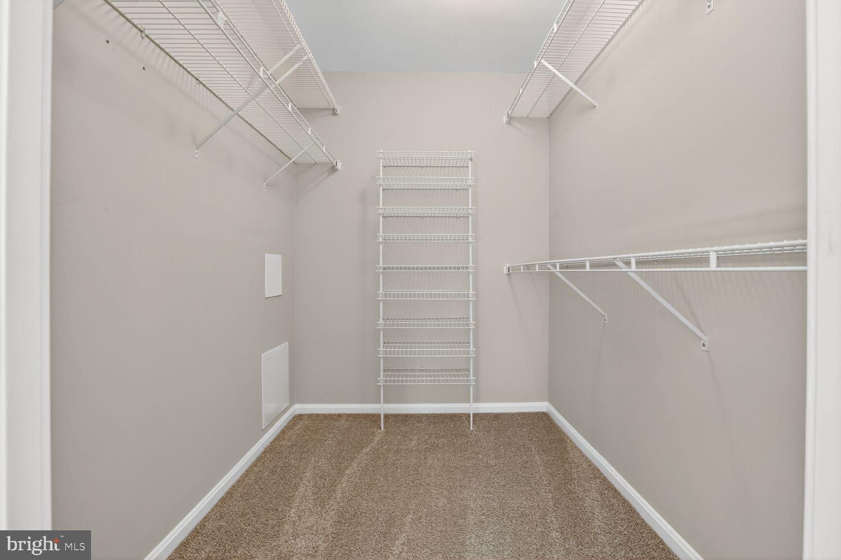 4106 Chardel Road, Unit 2G Baltimore, MD 21236 - Photo 20 of 25 a view of walk in closet with empty racks