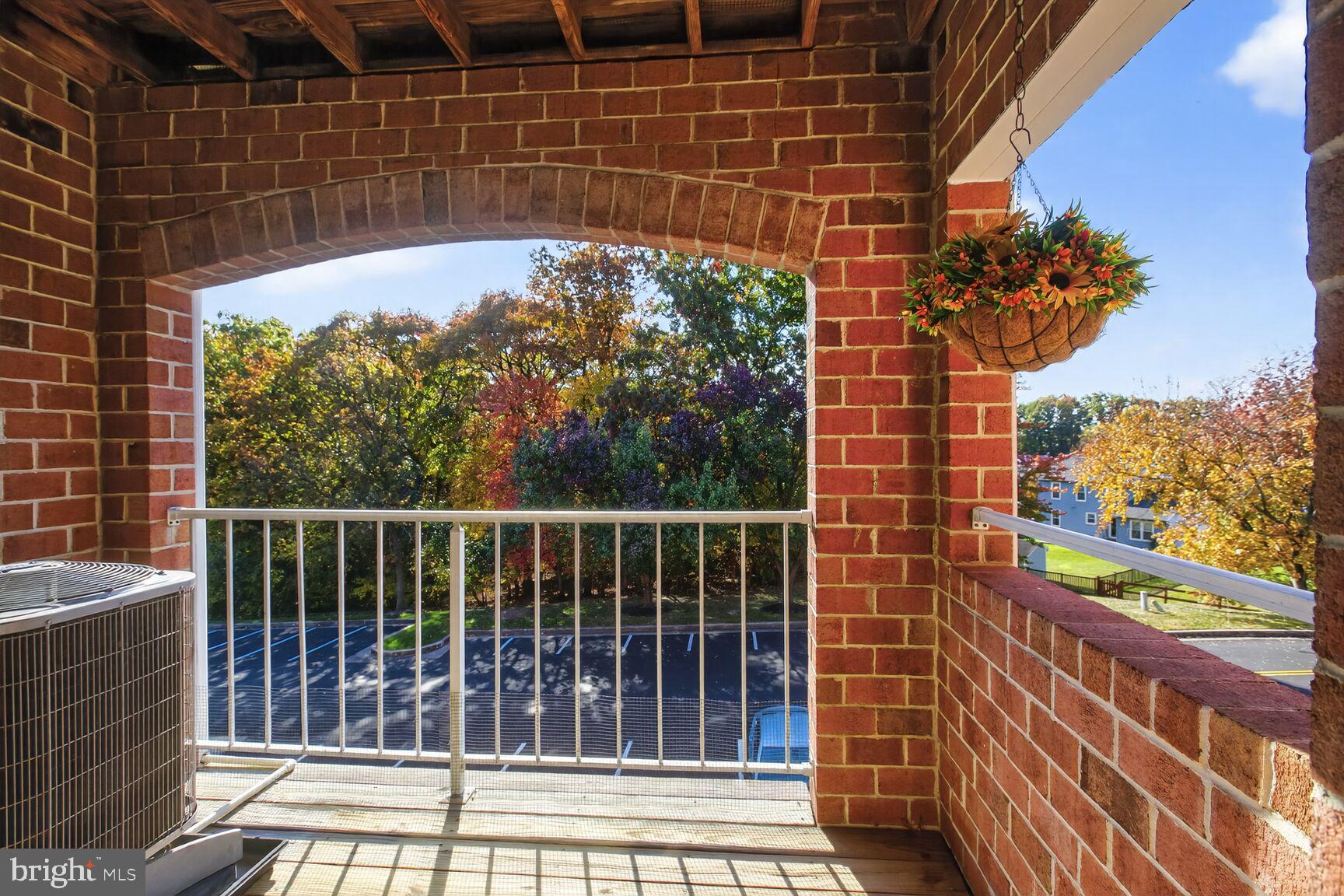 4106 Chardel Road, Unit 2G Baltimore, MD 21236 - Photo 23 of 25 a view of a balcony with a potted plant
