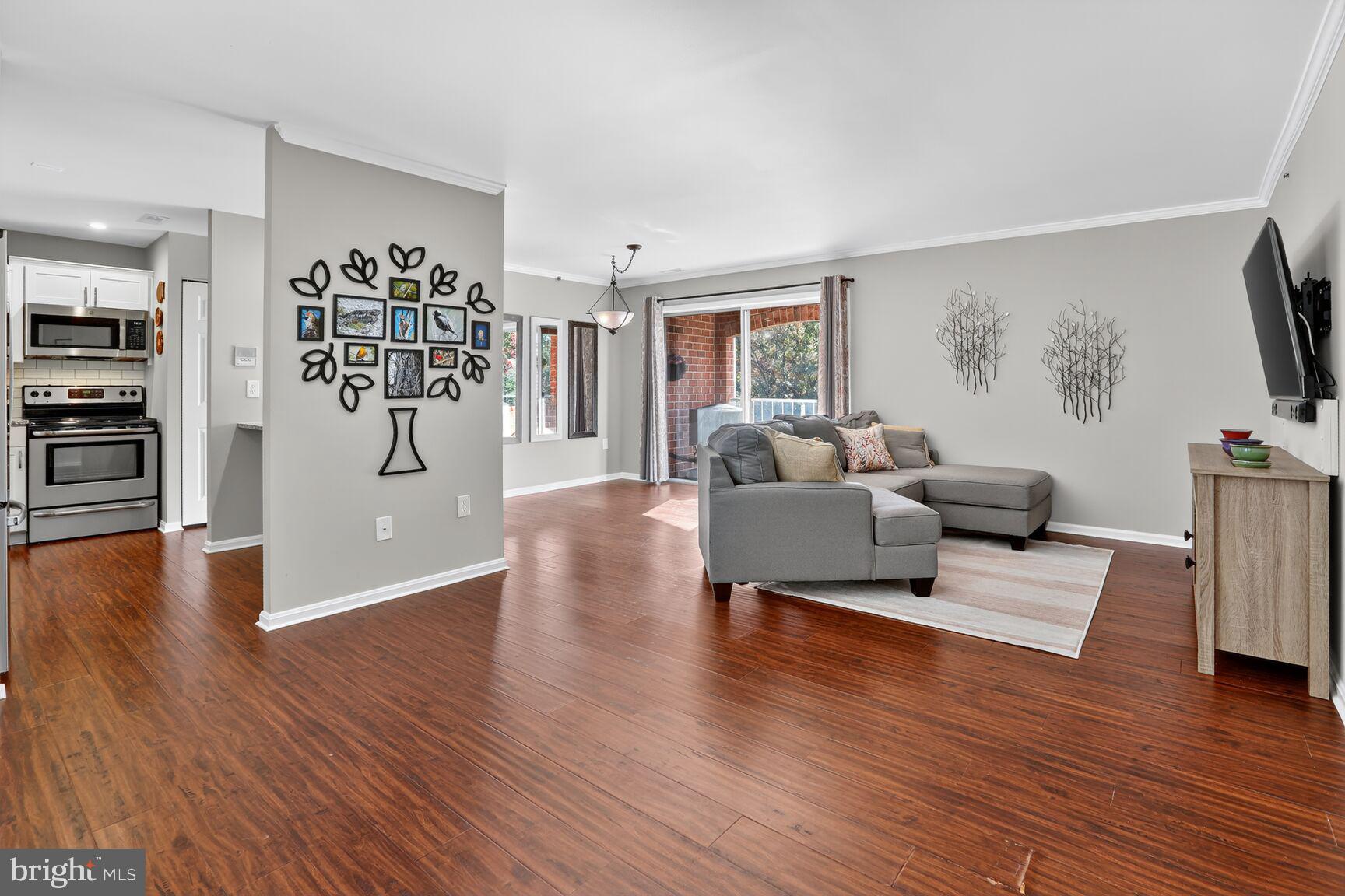 4106 Chardel Road, Unit 2G Baltimore, MD 21236 - Photo 25 of 25 a living room with furniture and a flat screen tv