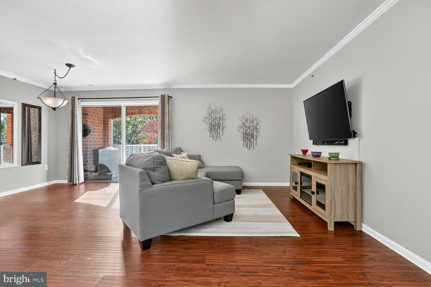 4106 Chardel Road, Unit 2G Baltimore, MD 21236 - Photo 3 of 25 a living room with furniture and a flat screen tv