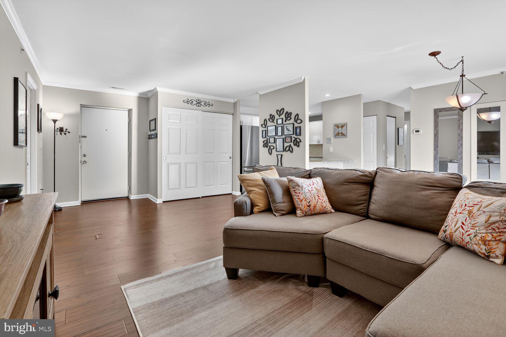4106 Chardel Road, Unit 2G Baltimore, MD 21236 - Photo 5 of 25 a living room with furniture and a wooden floor