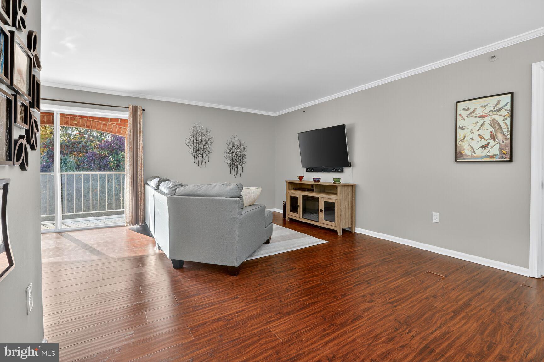 4106 Chardel Road, Unit 2G Baltimore, MD 21236 - Photo 6 of 25 a living room with furniture and a flat screen tv