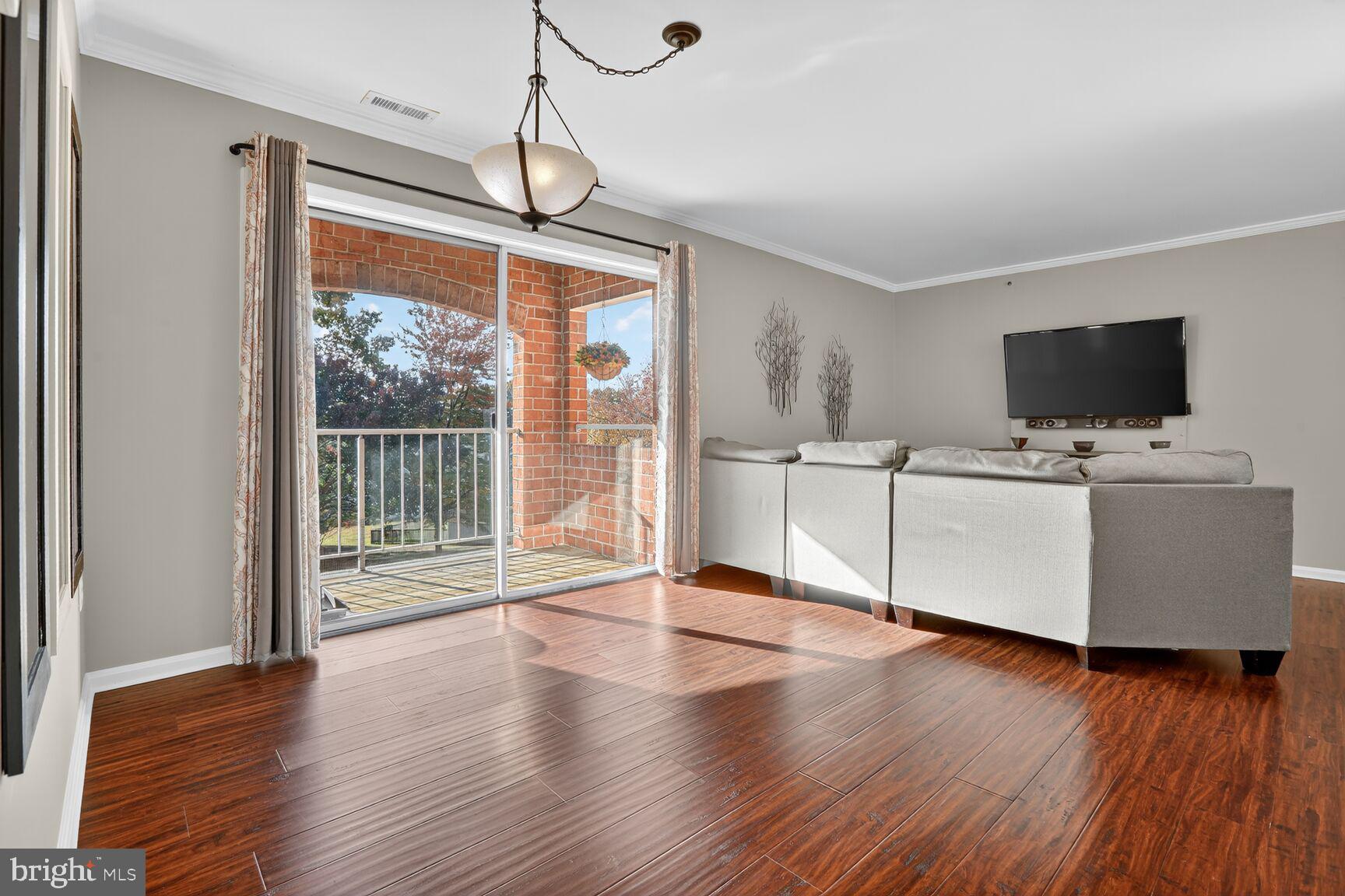 4106 Chardel Road, Unit 2G Baltimore, MD 21236 - Photo 7 of 25 a living room with furniture and a flat screen tv