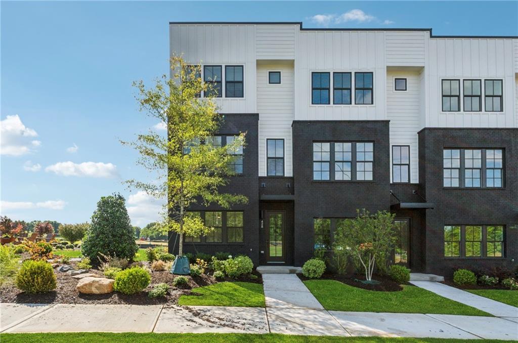428 Mezzo Lane Alpharetta, GA 30009 - Photo 1 of 1 a front view of a house with garden