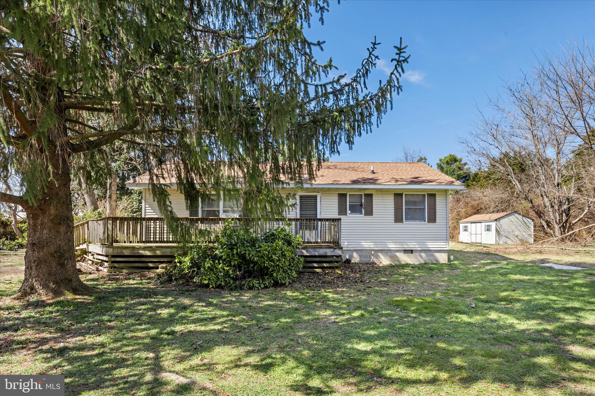 28359 Martins Farm Road Milton, DE 19968 - Photo 2 of 63 a front view of a house with a yard