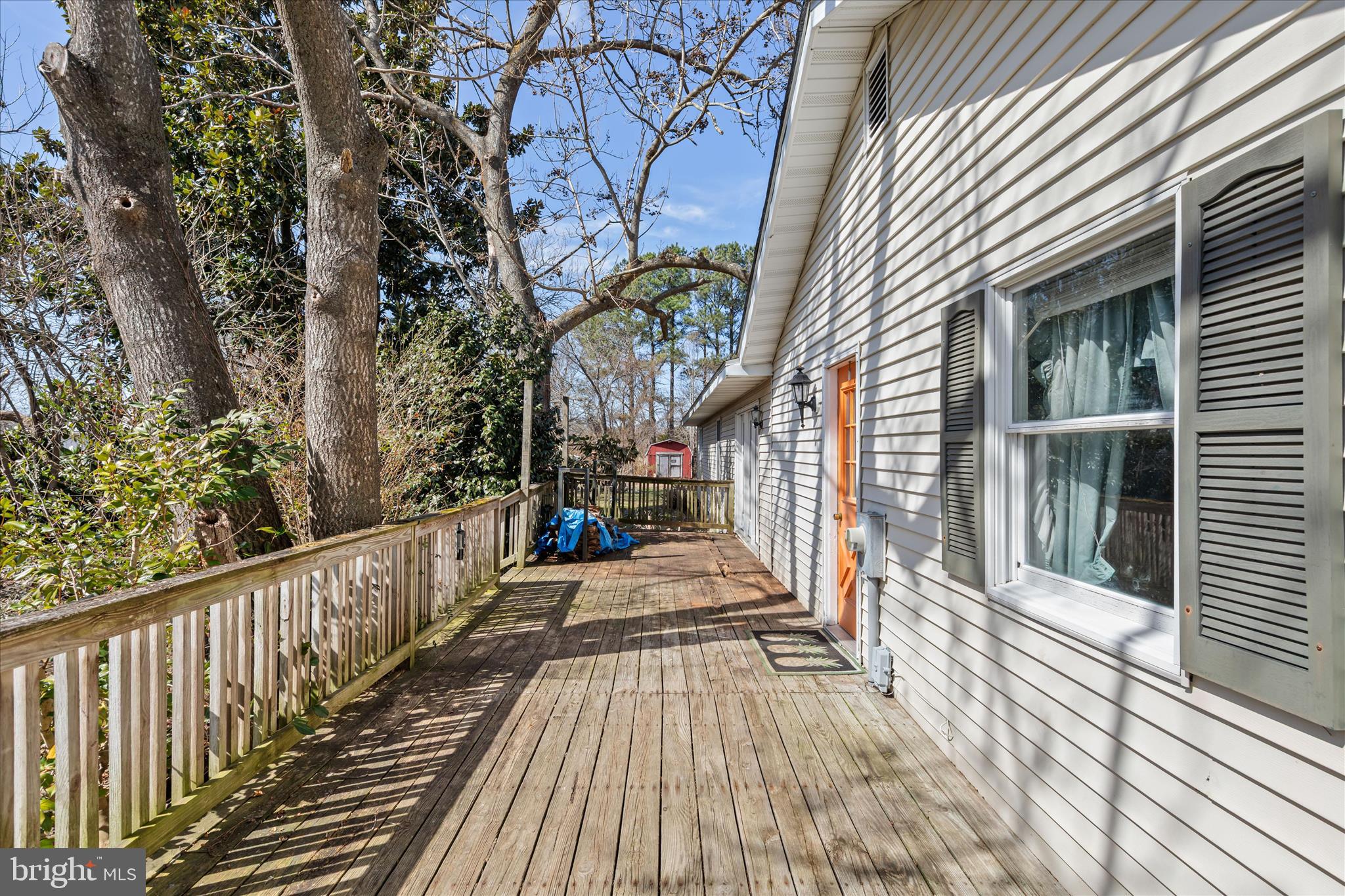 28359 Martins Farm Road Milton, DE 19968 - Photo 5 of 63 a view of a house with backyard and wooden deck