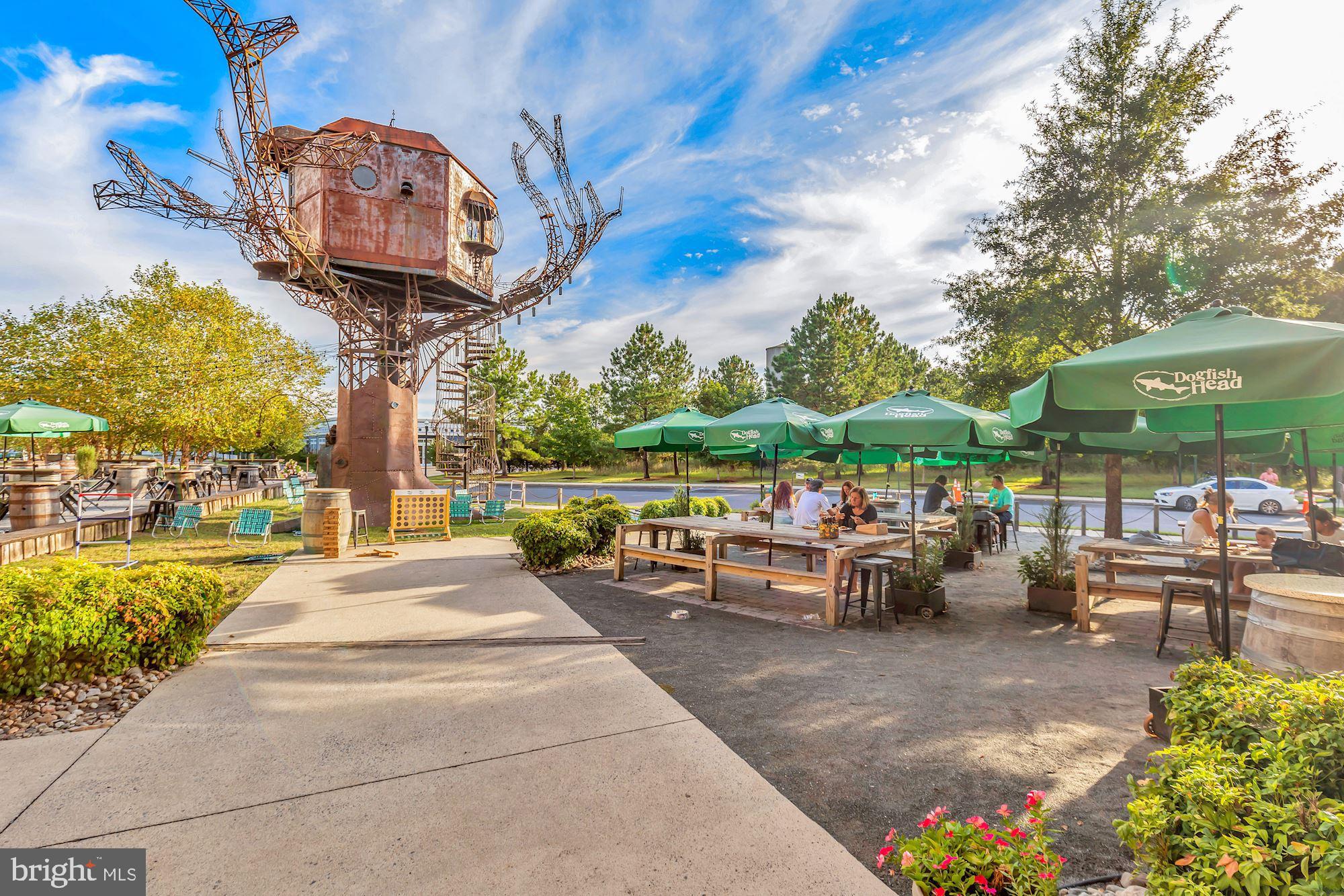 28359 Martins Farm Road Milton, DE 19968 - Photo 51 of 63 a view of a patio with a table and chairs under an umbrella