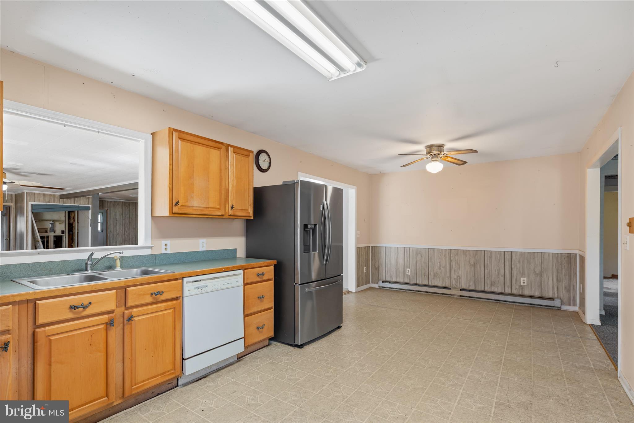 28359 Martins Farm Road Milton, DE 19968 - Photo 9 of 63 a kitchen with cabinets and stainless steel appliances