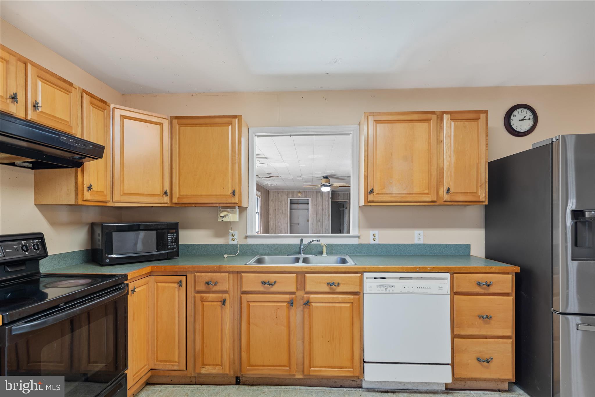 28359 Martins Farm Road Milton, DE 19968 - Photo 10 of 63 a kitchen with granite countertop cabinets stainless steel appliances and a counter space