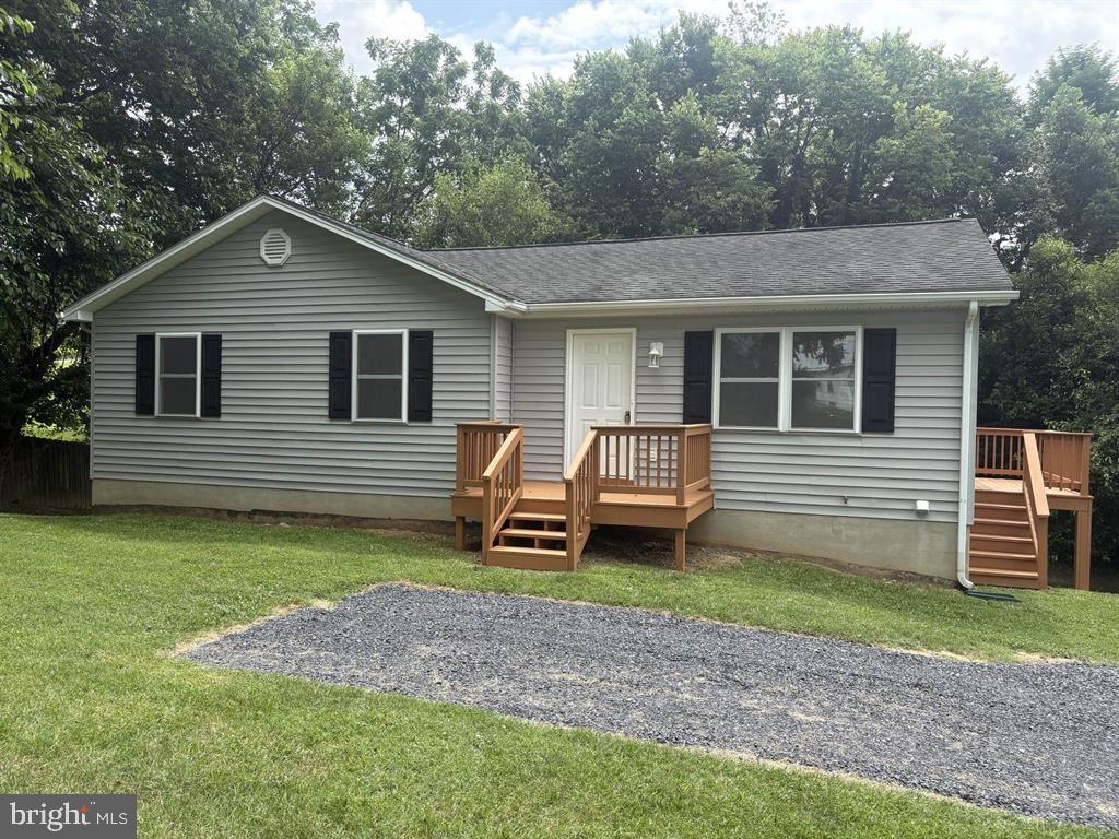 a backyard of a house with barbeque oven