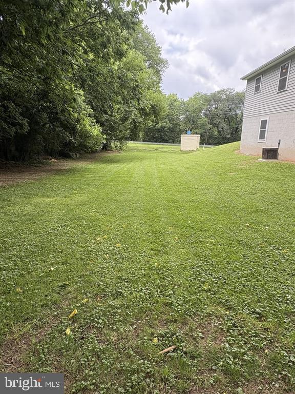 296 Bryce Boulevard Mount Jackson, VA 22842 - Photo 17 of 20 a view of a green yard with a house