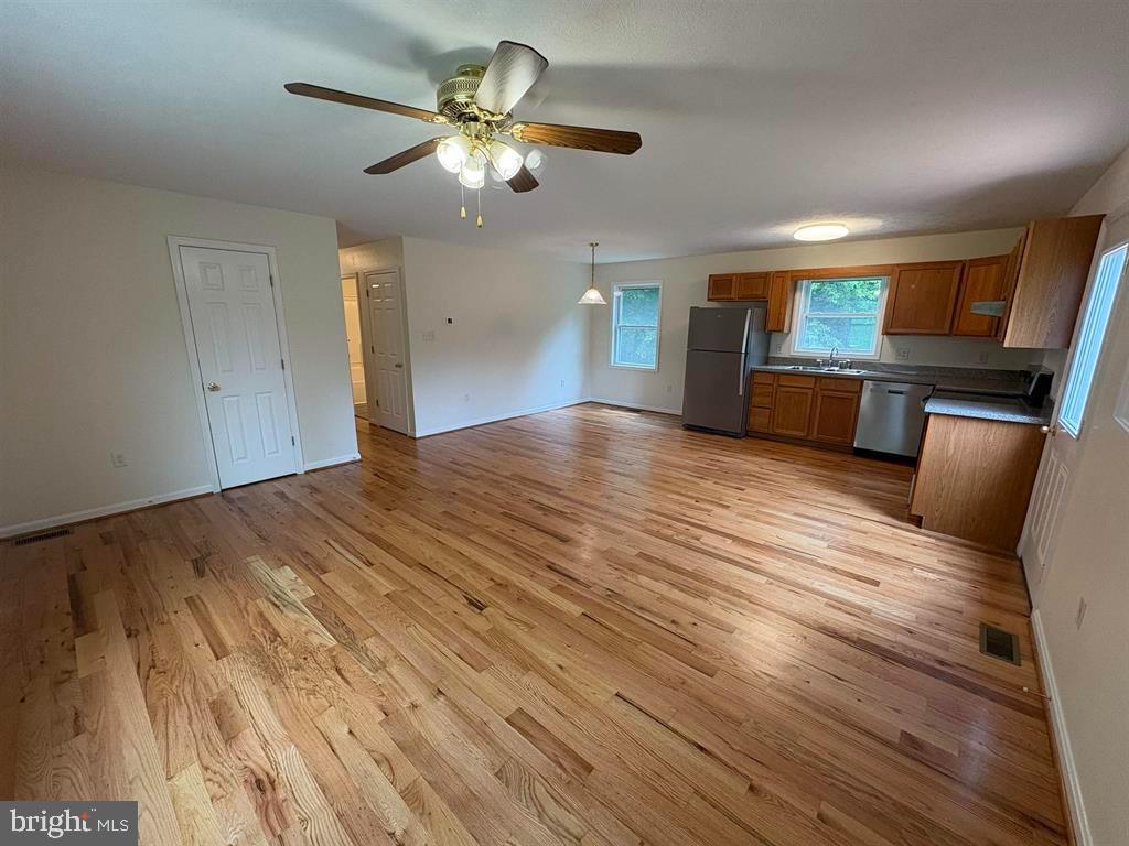 296 Bryce Boulevard Mount Jackson, VA 22842 - Photo 3 of 20 a view of a kitchen with a sink cabinets and wooden floor