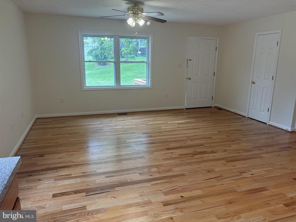296 Bryce Boulevard Mount Jackson, VA 22842 - Photo 5 of 20 a view of an empty room with wooden floor and a window