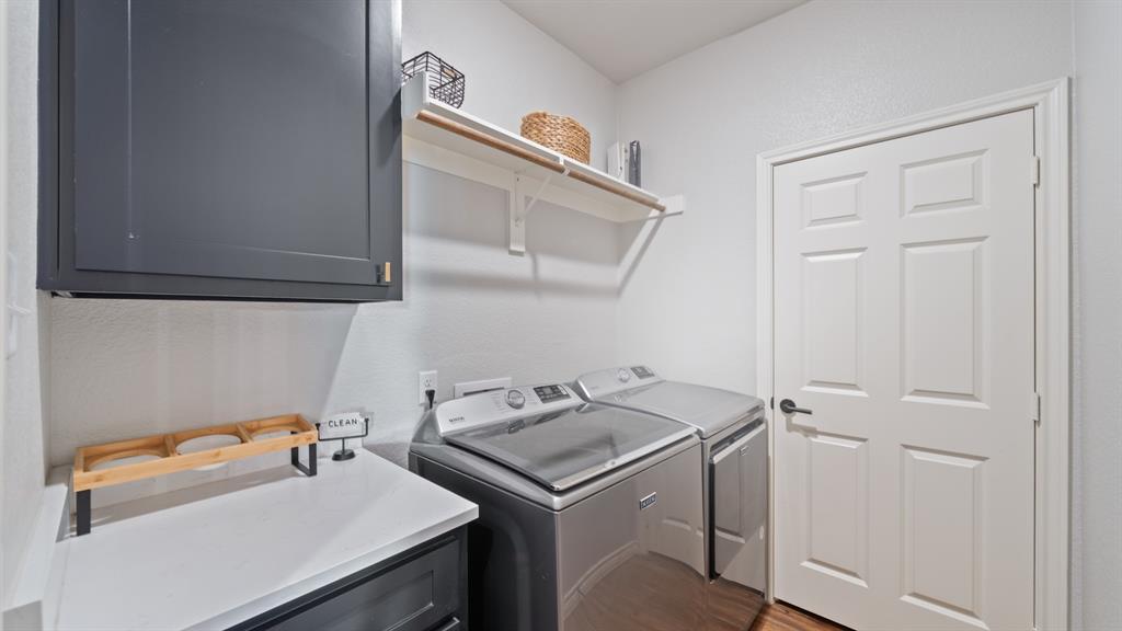 101 Lighthouse Lane Mabank, TX 75143 - Photo 26 of 40 Laundry room with cabinet space and independent washer and dryer