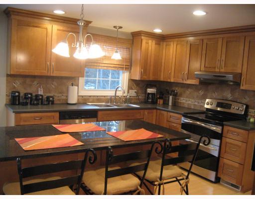 2004 Red Coach Road Allison Park, PA 15101 - Photo 5 of 18 Kitchen. 18x13 completely remodeled kitchen with maple honey glazed cabinets, ceramic tile backs plash, bamboo flooring, kenmore elite appliances, black granite center island with storage below, new sliding glass door to the rear deck
