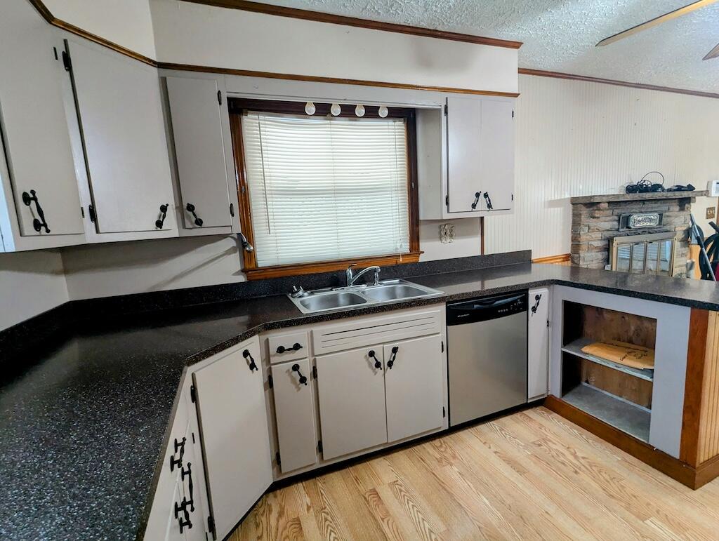 714 Glendale Road Galax, VA 24333 - Photo 11 of 26 a kitchen with granite countertop a sink a stove and cabinets