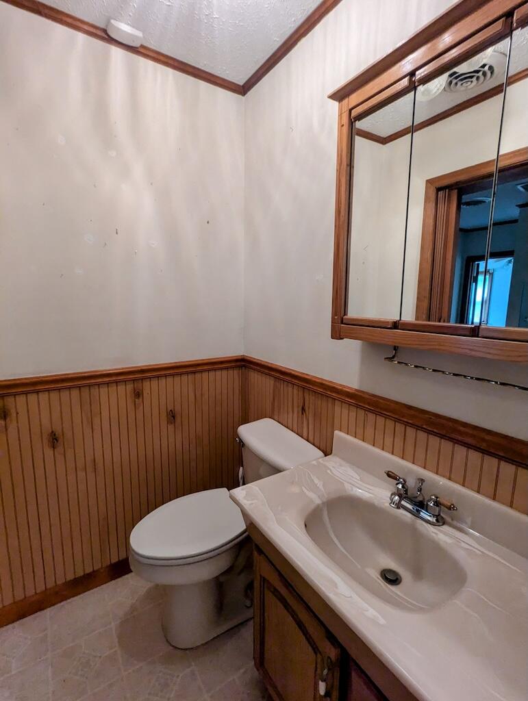 714 Glendale Road Galax, VA 24333 - Photo 18 of 26 a bathroom with a sink a toilet and mirror