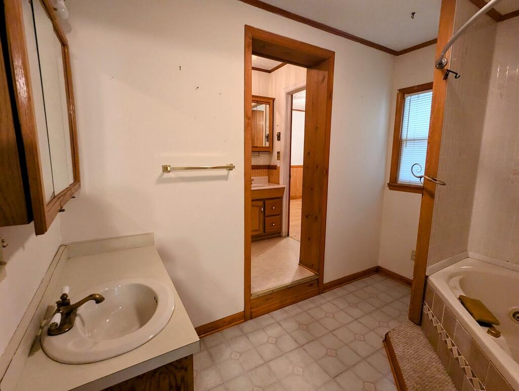 714 Glendale Road Galax, VA 24333 - Photo 19 of 26 a bathroom with a sink and a tub