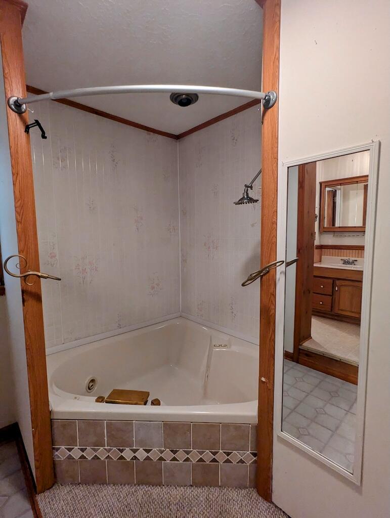 714 Glendale Road Galax, VA 24333 - Photo 20 of 26 a bathroom with a bathtub and a shower
