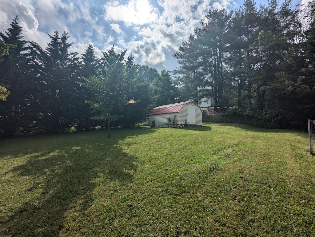 714 Glendale Road Galax, VA 24333 - Photo 26 of 26 a view of a backyard with large trees