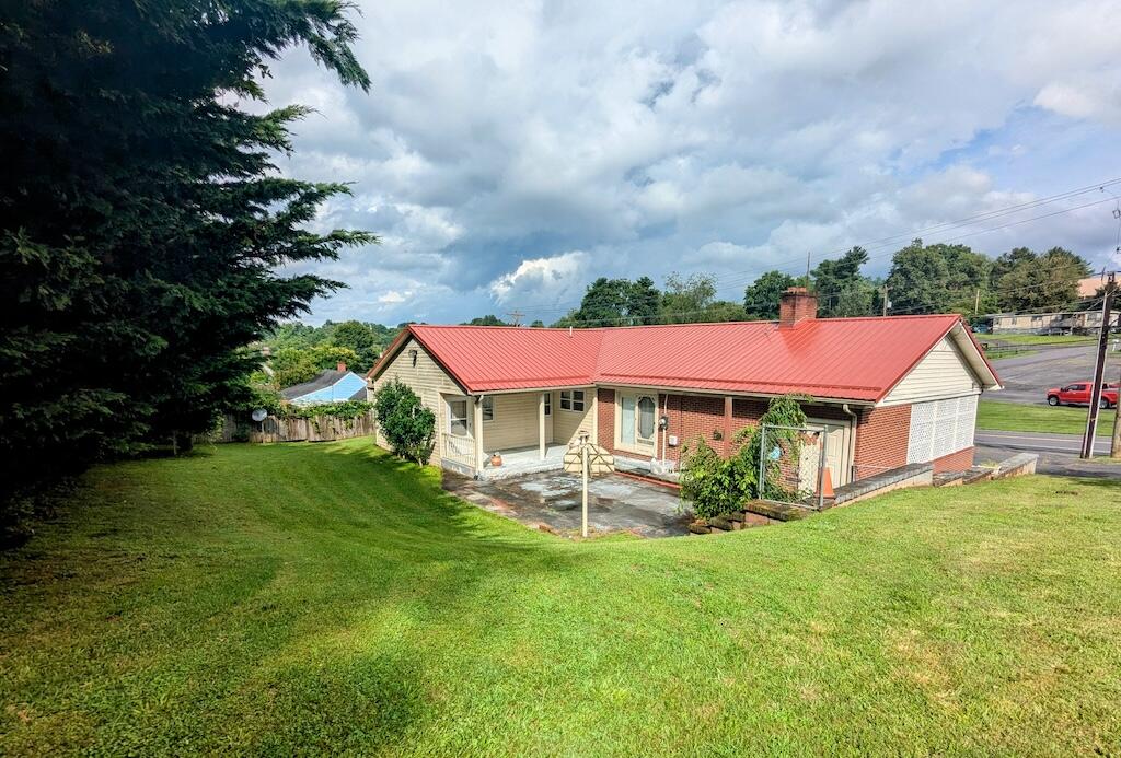 714 Glendale Road Galax, VA 24333 - Photo 4 of 26 a view of a house with a big yard and potted plants