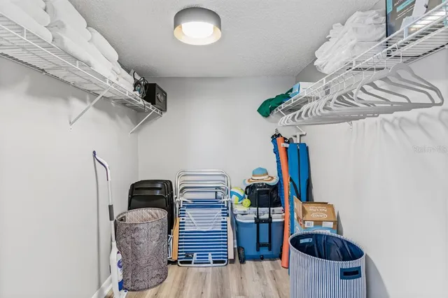 a view of storage and utility room with racks on the wall