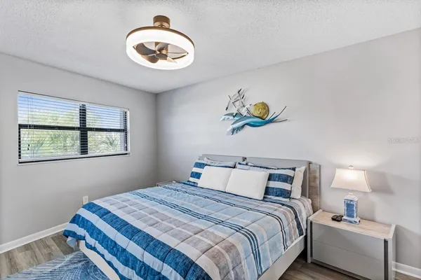 a bedroom with bed and a window