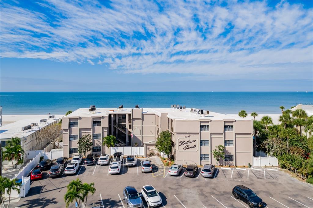 3210 Gulf Boulevard, Unit 307 Belleair Beach, FL 33786 - Photo 2 of 44 a view of building with sitting area