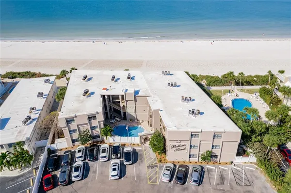 a view of roof deck with furniture and garden view