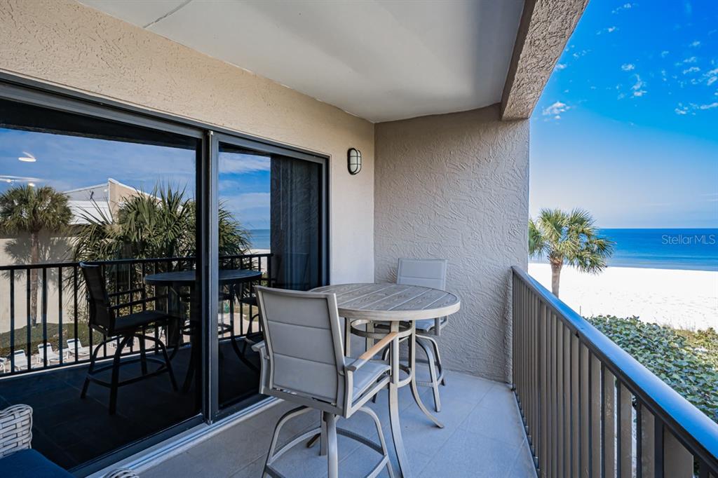3210 Gulf Boulevard, Unit 307 Belleair Beach, FL 33786 - Photo 4 of 44 a view of a balcony with chairs