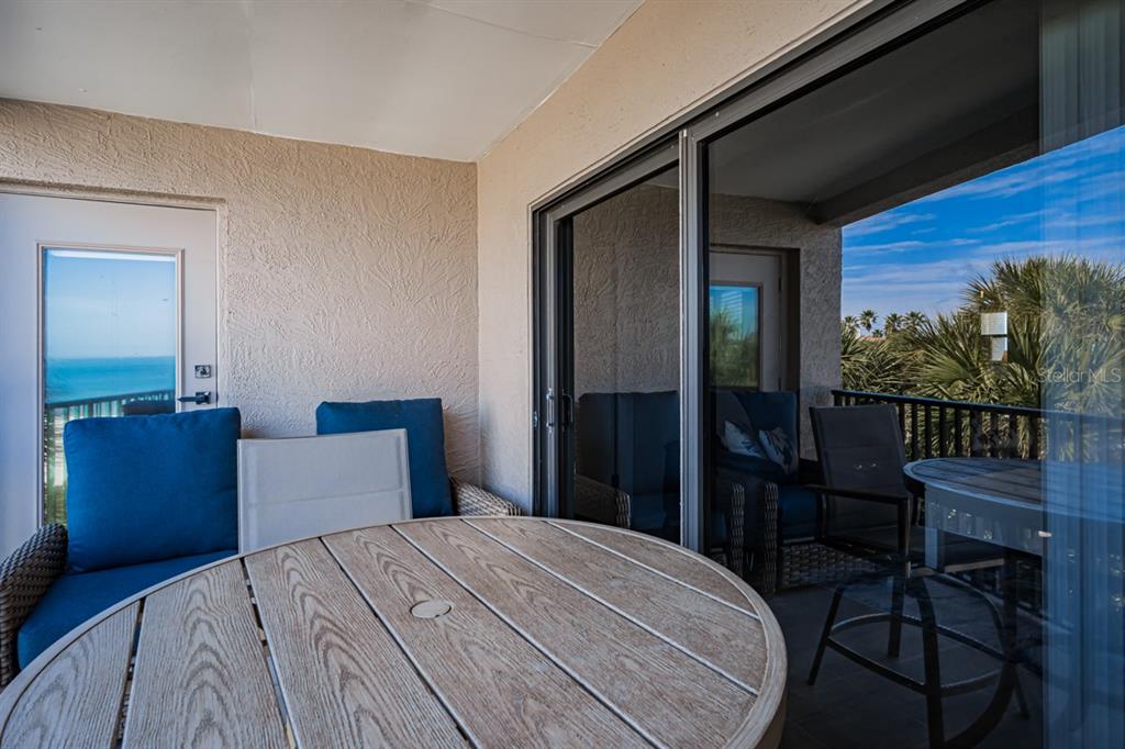 3210 Gulf Boulevard, Unit 307 Belleair Beach, FL 33786 - Photo 5 of 44 a bedroom with a bed and wooden floor