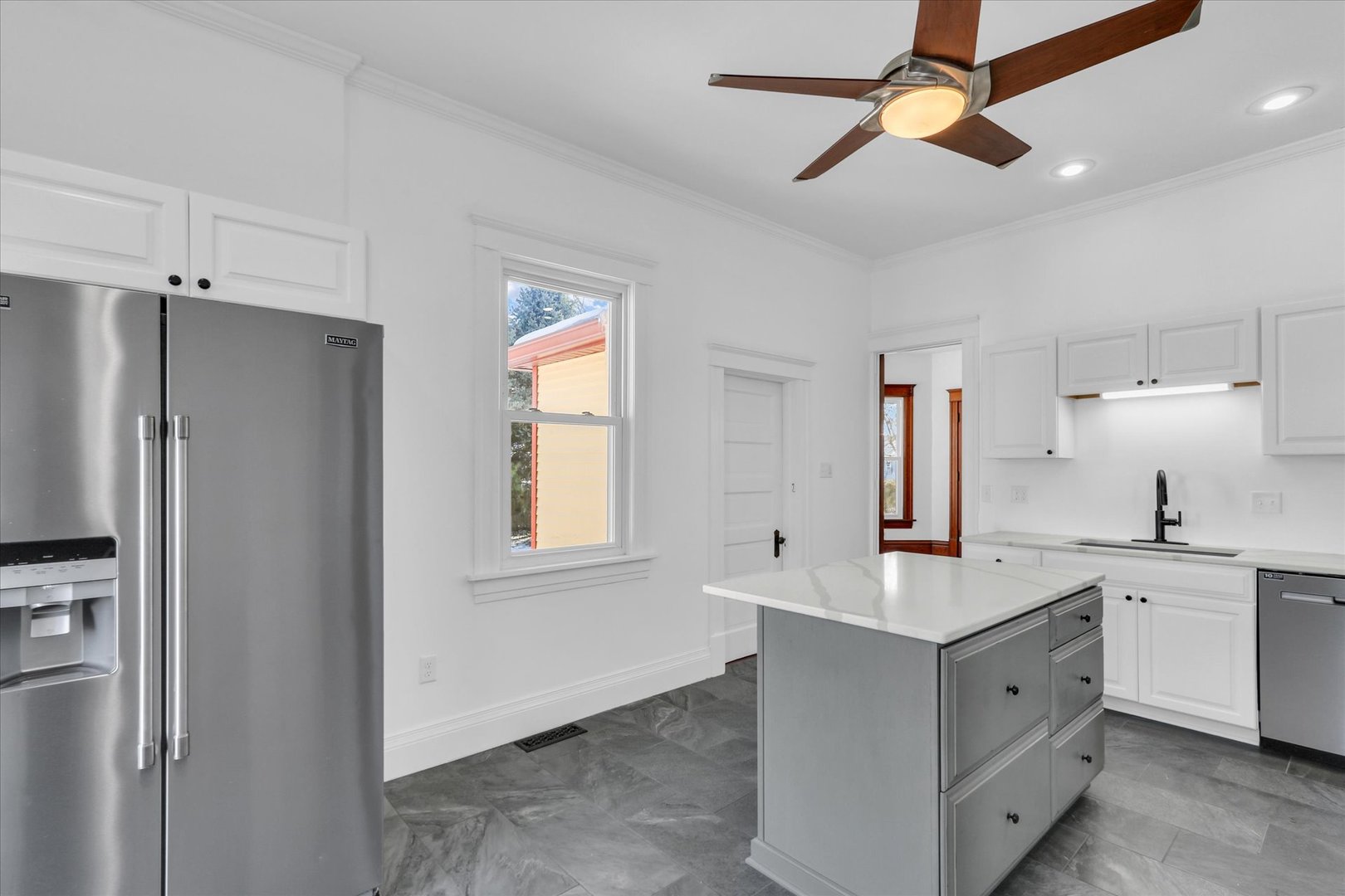 202 East Daggy Street Tuscola, IL 61953 - Photo 13 of 45 a spacious bathroom with a sink a mirror and a shower