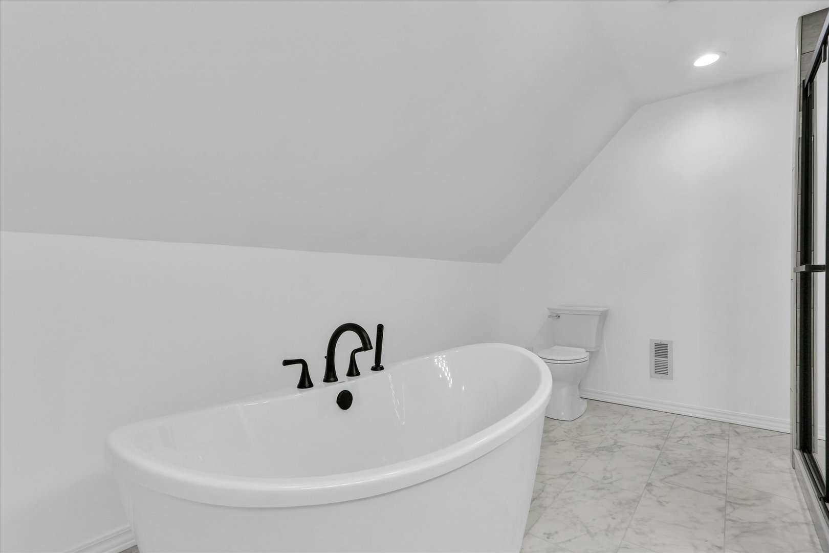 202 East Daggy Street Tuscola, IL 61953 - Photo 30 of 45 a white bath tub sitting in a bathroom