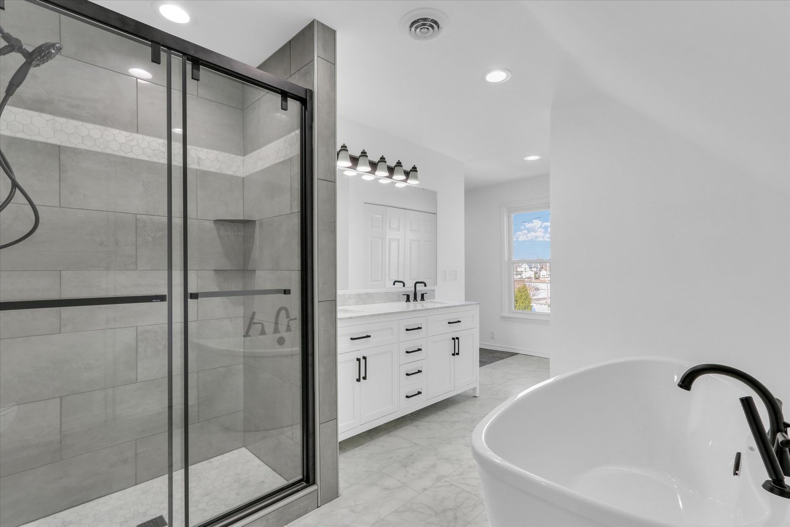 202 East Daggy Street Tuscola, IL 61953 - Photo 31 of 45 a bathroom with a bathtub and a shower
