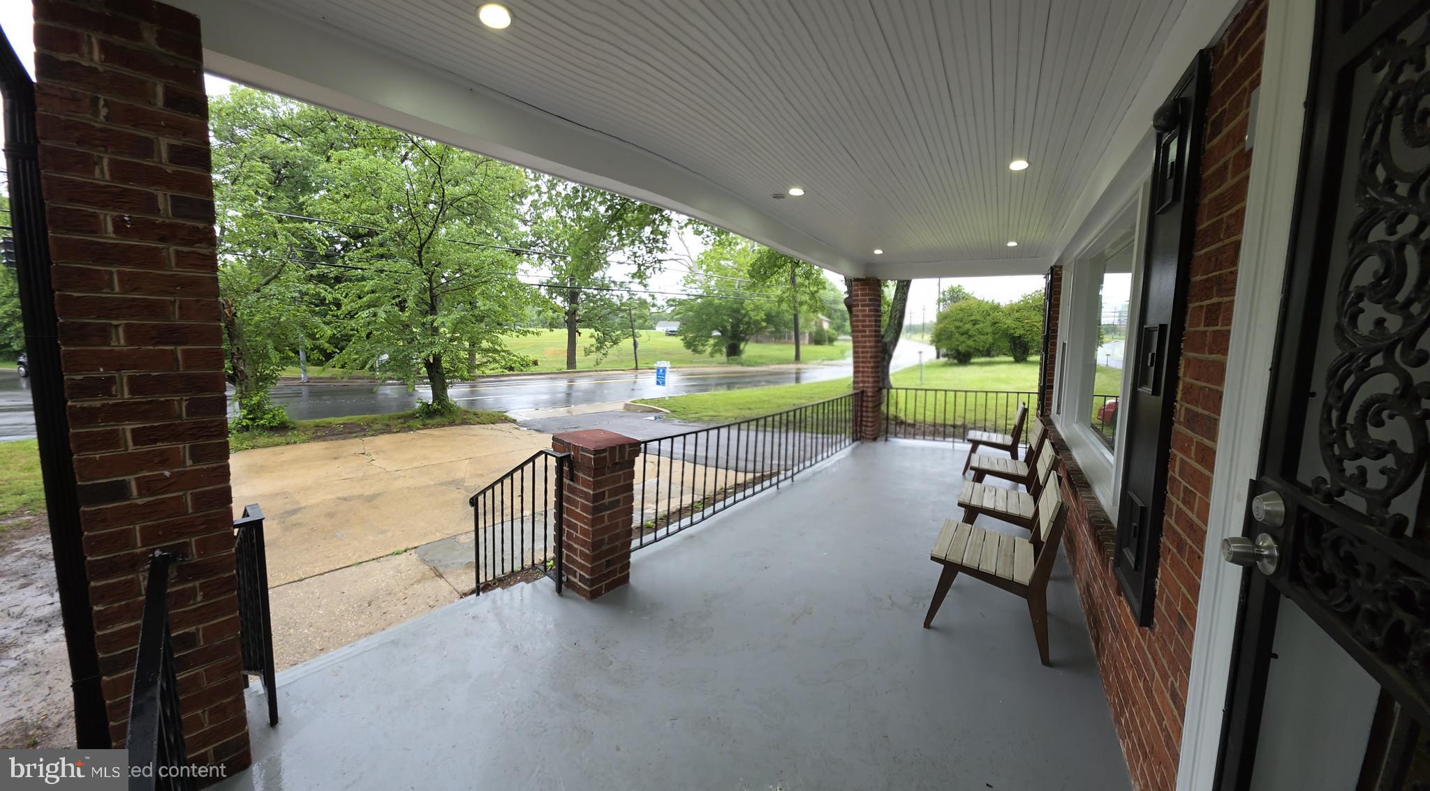 2206 Brinkley Road Fort Washington, MD 20744 - Photo 17 of 78 a view of a porch with chairs and backyard
