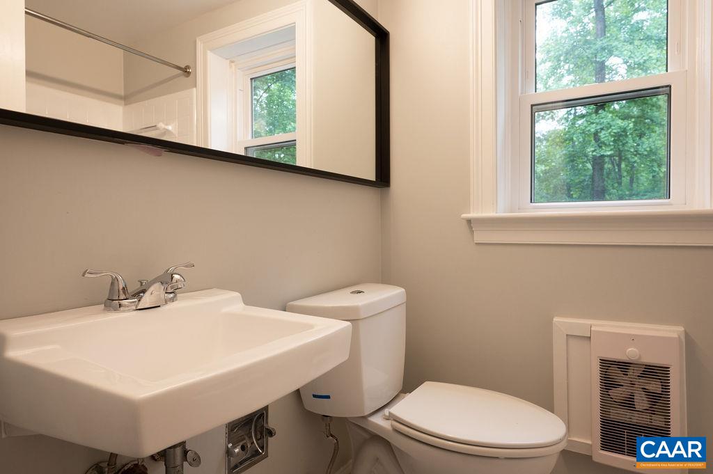 1710 Old Forge Road Charlottesville, VA 22901 - Photo 24 of 31 a bathroom with a sink a toilet and a mirror