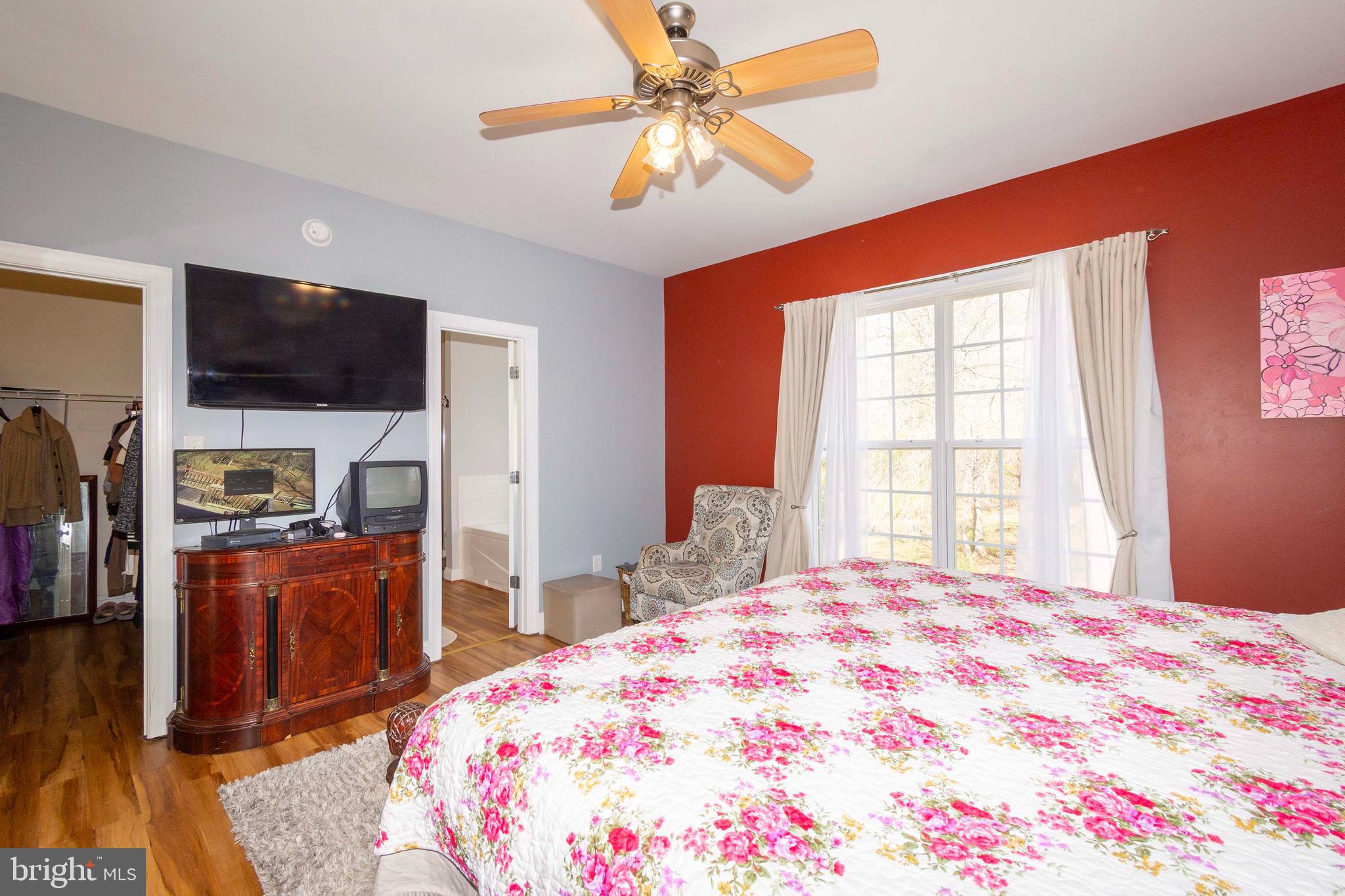 2203 Campbell Road Gordonsville, VA 22942 - Photo 17 of 53 a bedroom with a bed and a flat screen tv