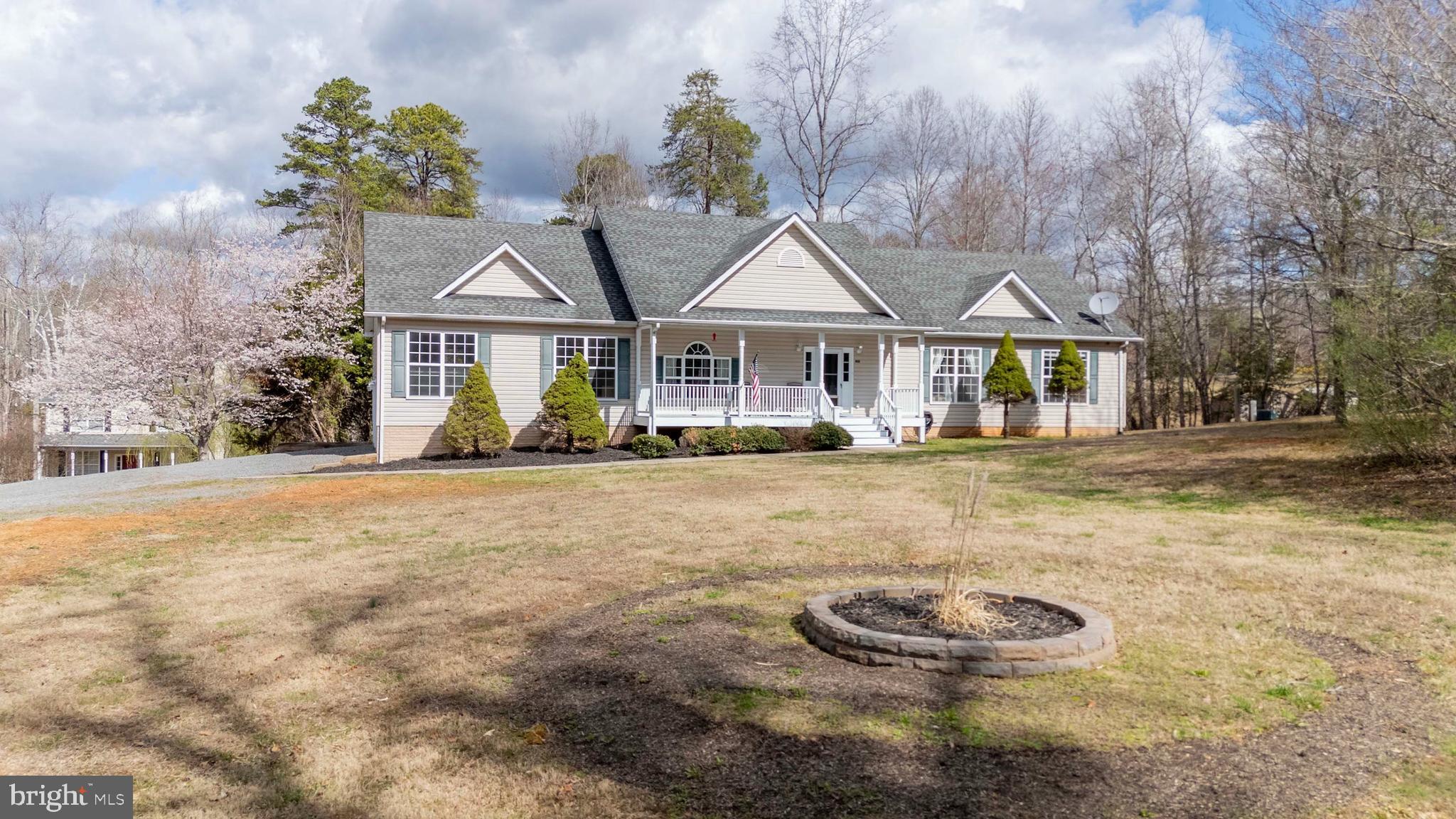 2203 Campbell Road Gordonsville, VA 22942 - Photo 3 of 53 a front view of a house with a yard