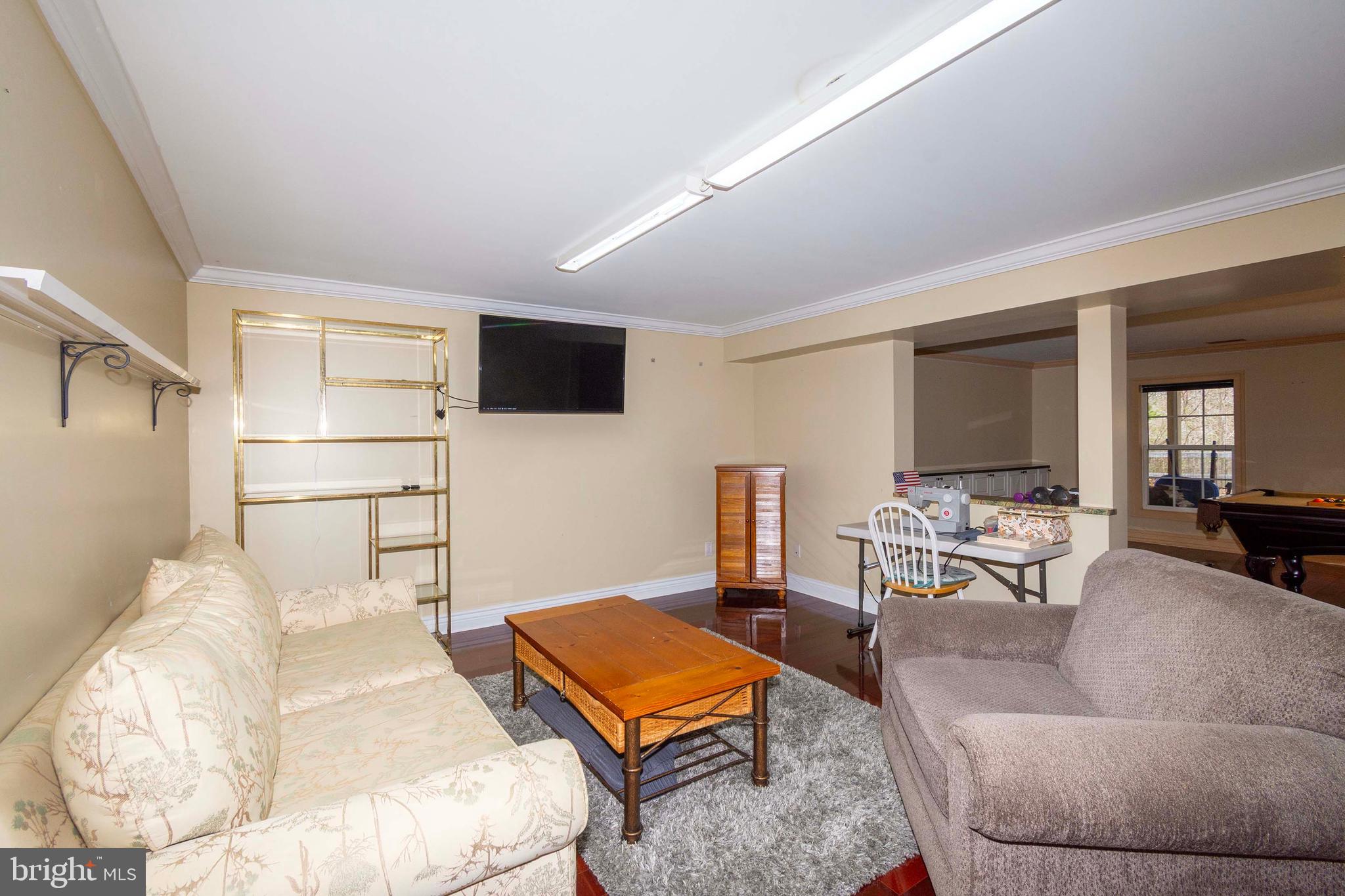 2203 Campbell Road Gordonsville, VA 22942 - Photo 32 of 53 a living room with furniture and a flat screen tv