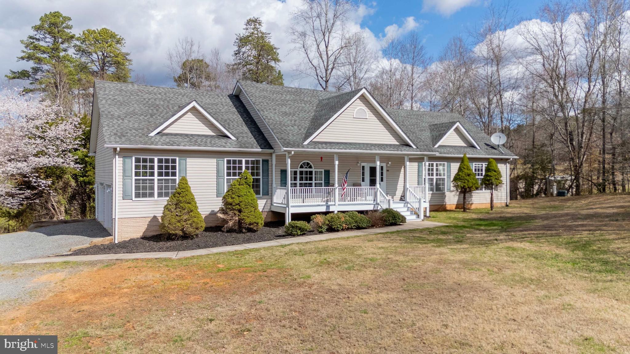 2203 Campbell Road Gordonsville, VA 22942 - Photo 42 of 53 a front view of a house with a garden