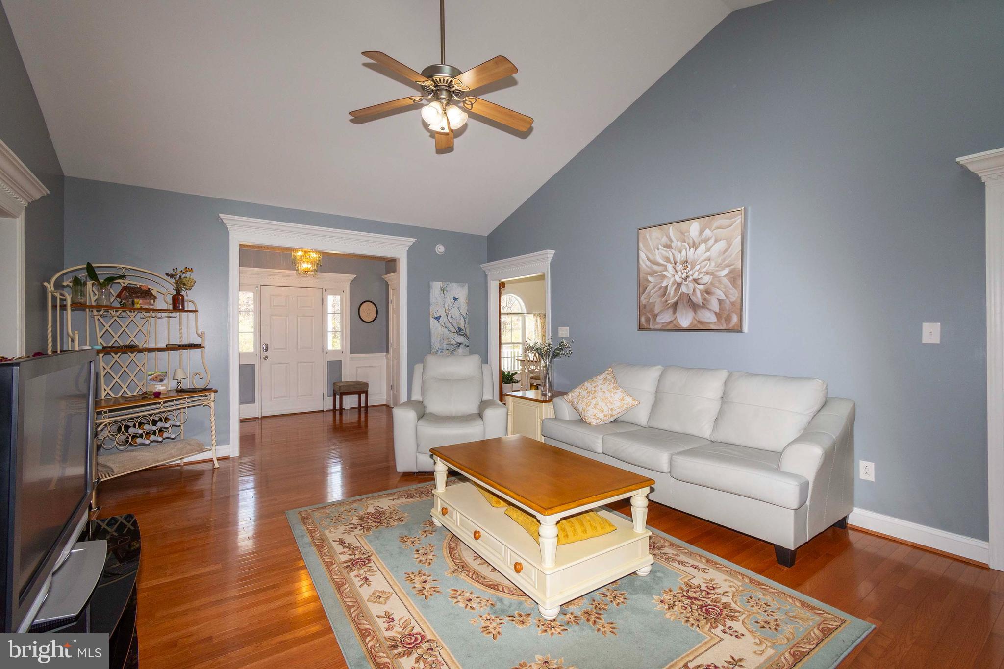 2203 Campbell Road Gordonsville, VA 22942 - Photo 7 of 53 a living room with furniture a rug and a chandelier