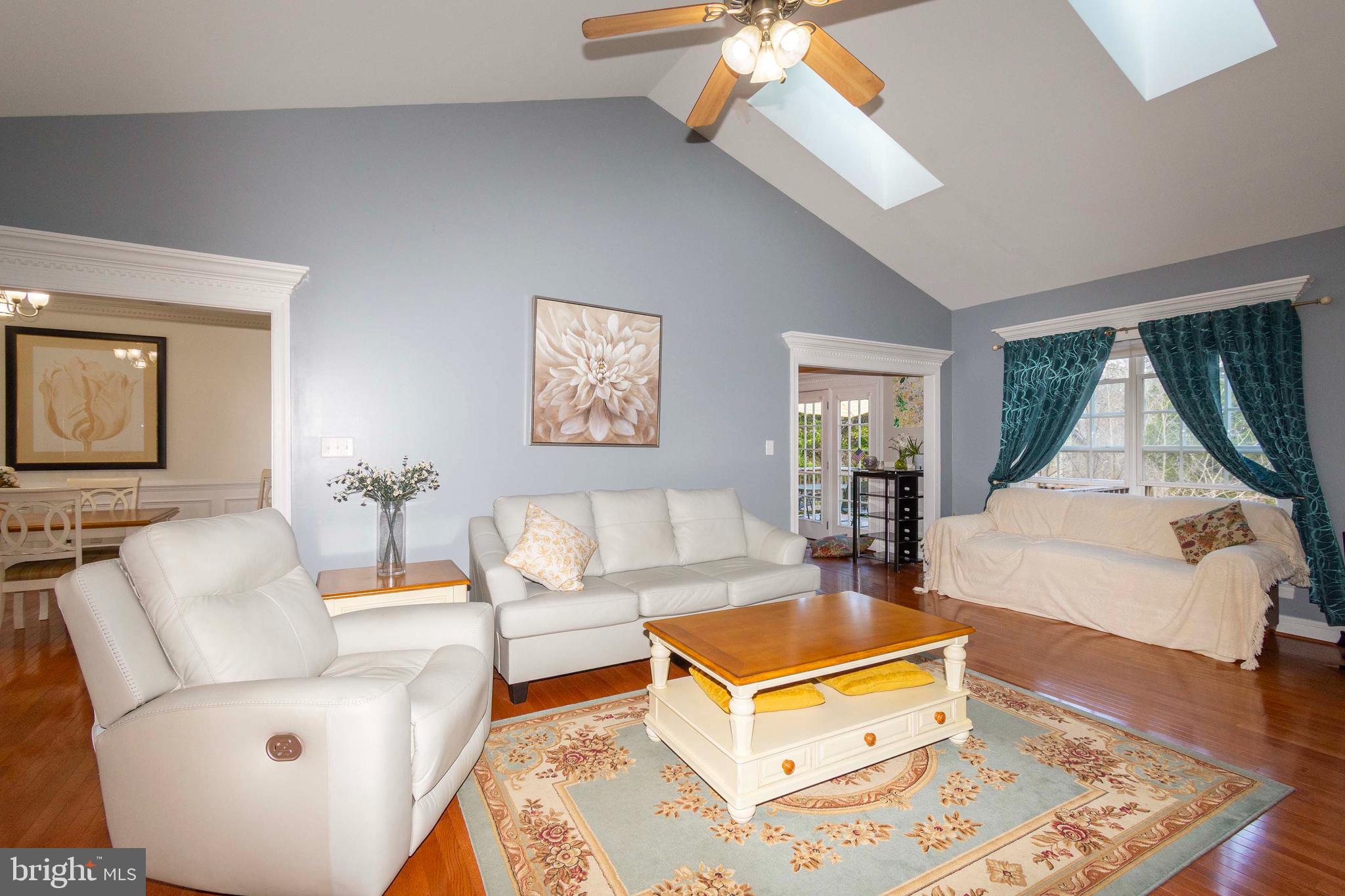2203 Campbell Road Gordonsville, VA 22942 - Photo 8 of 53 a living room with furniture a rug and a chandelier