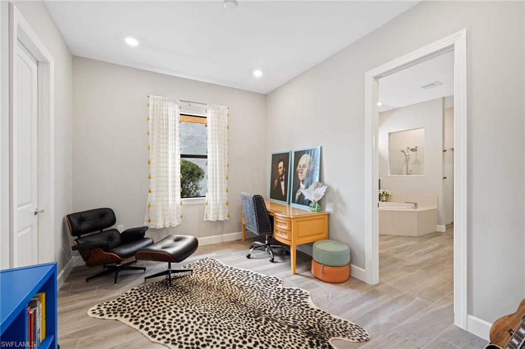 19134 Elston Way Estero, FL 33928 - Photo 21 of 35 a living room with furniture and a window