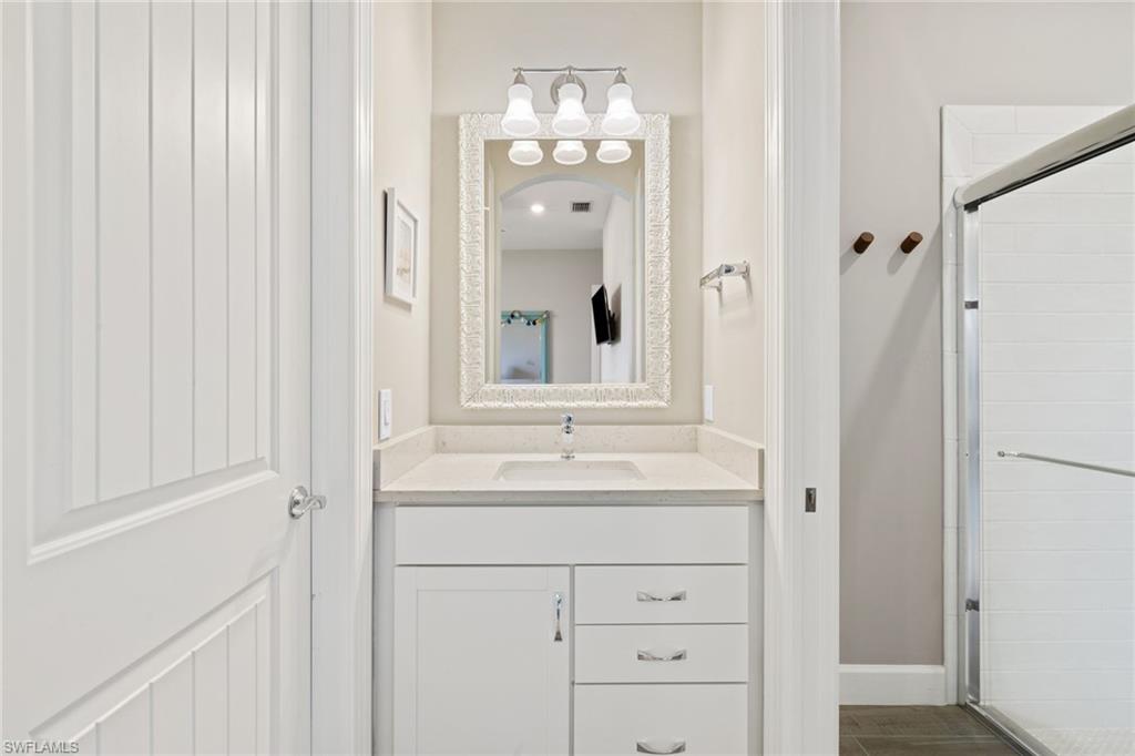 19134 Elston Way Estero, FL 33928 - Photo 27 of 35 a bathroom with a sink and a mirror