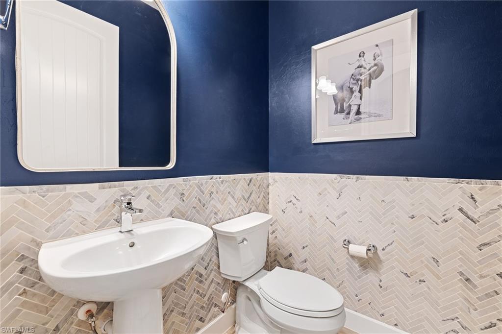 19134 Elston Way Estero, FL 33928 - Photo 29 of 35 a bathroom with a sink and a mirror