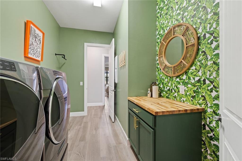 19134 Elston Way Estero, FL 33928 - Photo 30 of 35 a bathroom with a granite countertop sink and a mirror