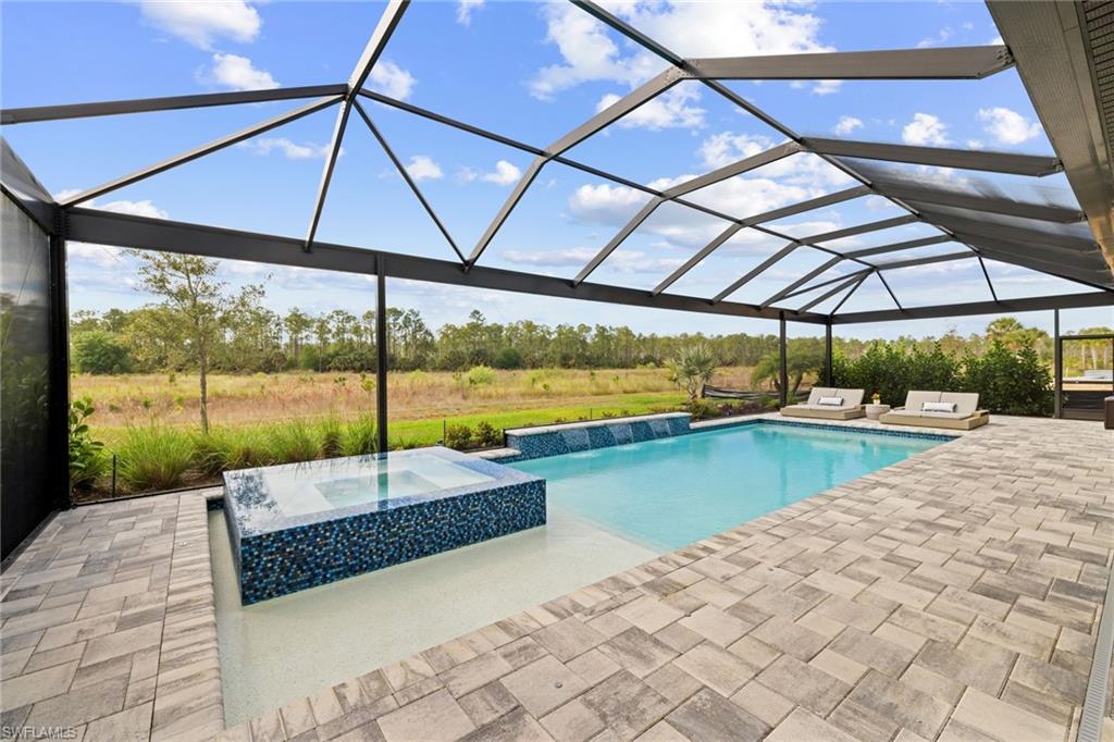19134 Elston Way Estero, FL 33928 - Photo 6 of 35 a view of a swimming pool with a porch