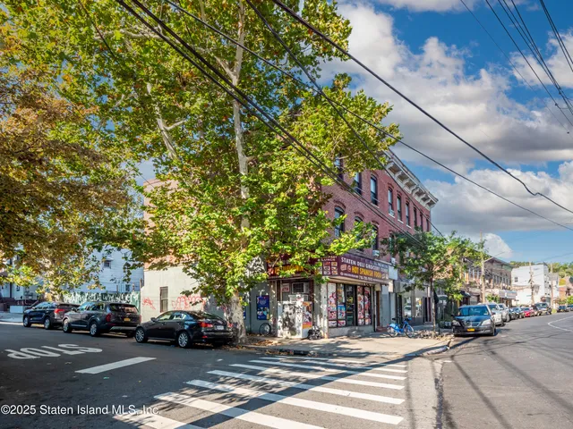 a couple of cars parked in front of building