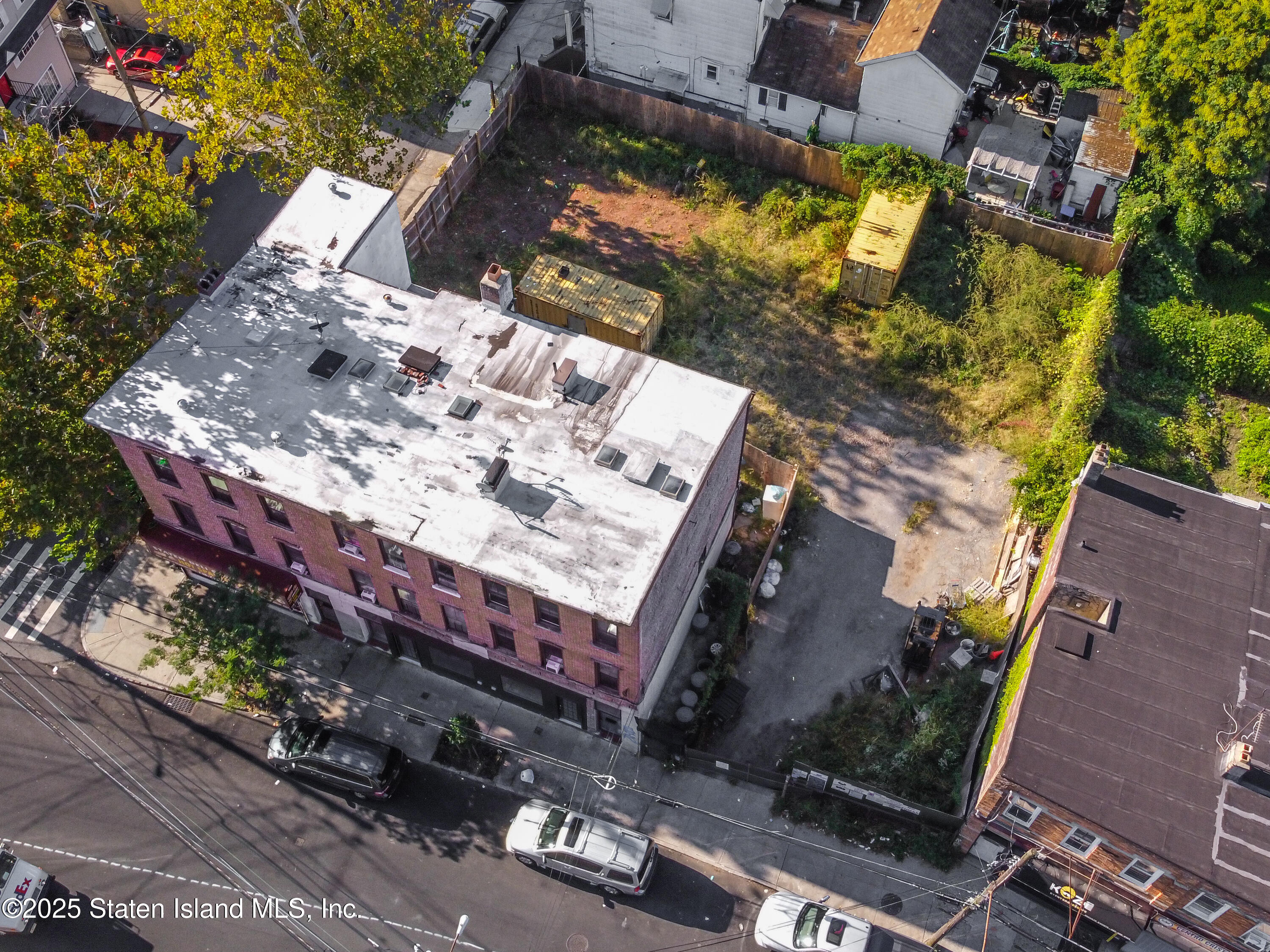 Undisclosed Address Staten Island, NY 10301 - Photo 7 of 7 an aerial view of a house with a yard